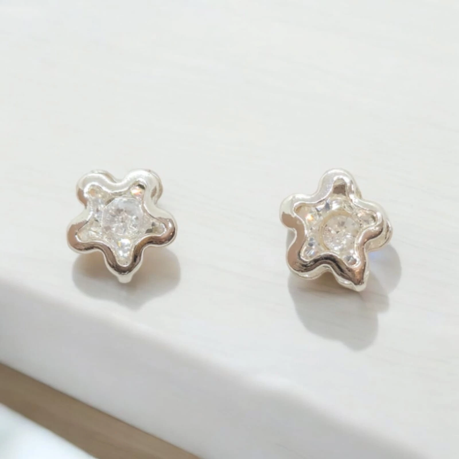 Brinco Ponto de Luz Estrela